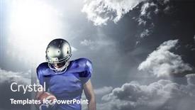  Presentation with spotlight - Cool new theme with american football player looking down while holding ball against spotlight in sky backdrop and a gray colored foreground