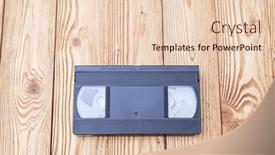  Presentation with cassette - PPT theme consisting of analog-video-cassette-on-wooden background and a lemonade colored foreground