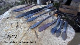  Presentation with ancient - PPT theme with ancient arrowheads on wooden table background and a light gray colored foreground