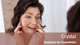  Presentation with face scrub cream - Presentation theme consisting of anti wrinkle - senior woman applying cream background and a tawny brown colored foreground