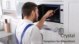  Presentation with kitchen appliance - Beautiful presentation featuring appliance - young man repairing microwave oven backdrop and a light gray colored foreground