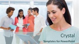  Presentation with coworkers - Presentation with attractive businesswoman using tablet while her coworkers are working behind her background and a lemonade colored foreground