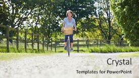  Presentation with bike - Presentation design enhanced with attractive mature woman riding bike along country lane background and a soft green colored foreground