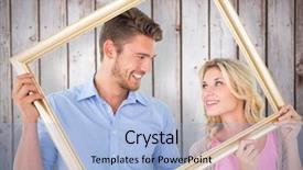  Presentation with picture frame - PPT theme with attractive young couple holding picture frame against wooden planks background and a light blue colored foreground