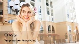  Presentation with pearls - Cool new PPT theme with attractive young woman wearing a white dress and pearls is leaning over a ledge with her head in her hands smiling she has a purple flower in her hair horizontal shot backdrop and a coral colored foreground