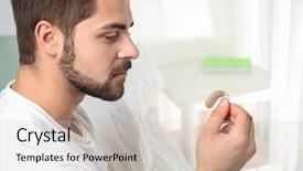  Presentation with hearing aid - Colorful PPT theme enhanced with audiology - young man holding hearing aid backdrop and a soft green colored foreground