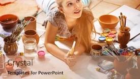  Presentation with dreams - Audience pleasing theme consisting of authentic artist children girl paints with set palette watercolor paints palette and brush in morning sunlight painting in studio on floor child dreams of going to art school backdrop and a coral colored foreground