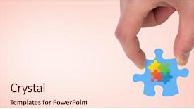  Presentation with hand holding puzzle piece - Amazing presentation theme having holding jigsaw piece against orange backdrop and a cream colored foreground