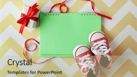  Presentation with notebook - PPT theme enhanced with baby boots and notebook top background and a mint green colored foreground