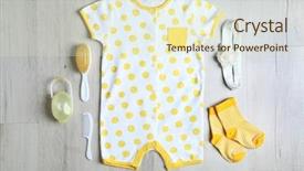  Presentation with baby clothes - Amazing slide deck having baby clothes and accessories on wooden background backdrop and a soft green colored foreground