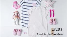  Presentation with baby clothes - Colorful presentation theme enhanced with baby clothes and accessories on white background backdrop and a light gray colored foreground