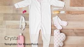  Presentation with baby clothes - Beautiful PPT theme featuring baby-clothes-and-accessories backdrop and a soft green colored foreground