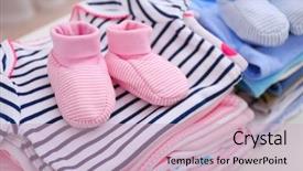  Presentation with baby clothes - Theme with baby clothes for newborn background and a soft green colored foreground