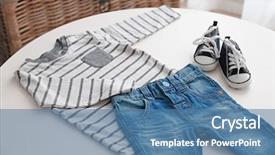  Presentation with baby clothes - Beautiful presentation theme featuring baby clothes on a table backdrop and a teal colored foreground