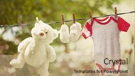  Presentation with baby clothes - Theme having baby girl clothes hanging background and a  colored foreground