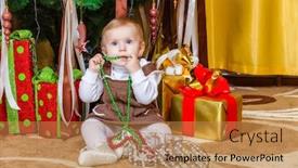  Presentation with baby tree - Slide deck with baby-girl-sitting-under-christmas background and a coral colored foreground