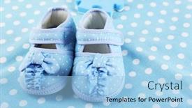 Presentation with baby shoes - Beautiful theme featuring baby shoes on cloth background backdrop and a light blue colored foreground