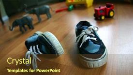  Presentation with baby shoes - Presentation design consisting of baby shoes background and a tawny brown colored foreground