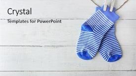  Presentation with socks - PPT theme having first born - baby socks hanging on white background and a white colored foreground