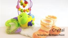  Presentation with baby toy - Amazing PPT theme having baby socks hat and toy backdrop and a coral colored foreground