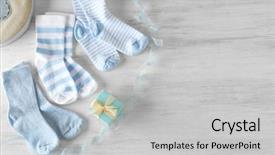  Presentation with baby clothes - Amazing slide set having clothes boys - baby socks on wooden background backdrop and a light gray colored foreground