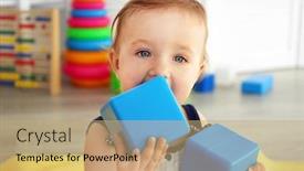 Presentation with baby blocks - PPT theme enhanced with baby with bright toy blocks in child room background and a coral colored foreground
