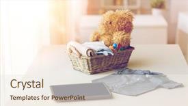  Presentation with motherhood - Slides having babyhood motherhood clothing technology and object concept - close up of baby clothes and toys for newborn boy in basket with tablet pc computer at home background and a sky blue colored foreground