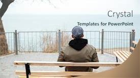  Presentation with man sitting bench - PPT theme consisting of back view picture of young african man wearing hat and scarf sitting on a bench on the street background and a sky blue colored foreground