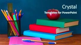  Presentation with apple on open books - Amazing PPT theme having books stationery and an apple backdrop and a ocean colored foreground