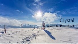  Presentation with winter sports - PPT theme consisting of backview of snowboarder walking on snowshoes in powder snow european alpine scenery winter sports and activities background and a light blue colored foreground