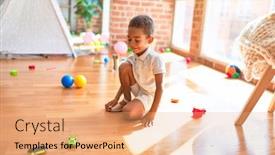  Presentation with cars - PPT theme consisting of beautiful african american toddler playing with cars around lots of toys at kindergarten background and a coral colored foreground