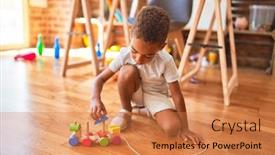  Presentation with wooden toy - Presentation theme with beautiful african american toddler playing with wooden blocks train toy around lots of toys at kindergarten background and a coral colored foreground