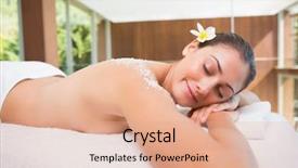  Presentation with table salt - Presentation theme enhanced with beautiful brunette lying on massage table with salt scrub on back in the health spa background and a coral colored foreground