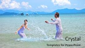  Presentation with beach wedding - Presentation theme enhanced with beautiful couple on the beach in wedding dress playing in the water background and a light gray colored foreground
