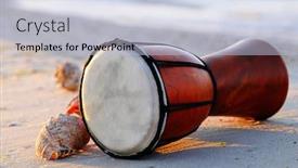  Presentation with drum - Presentation theme consisting of beautiful-ethnic-drum-with-seashells background and a light blue colored foreground