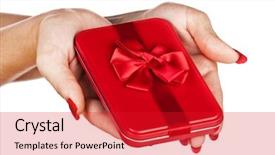  Presentation with gift ribbon - Presentation having beautiful hands of a young woman with red manicure holding a red tin gift box with red ribbon background and a crimson colored foreground
