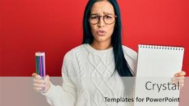  Presentation with colored pencils - Cool new PPT theme with beautiful-hispanic-woman-holding-canvas backdrop and a light gray colored foreground