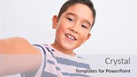  Presentation with teeth - Slide deck having beautiful kid boy wearing casual striped t-shirt make selfie over isolated white background with a happy face standing and smiling with a confident smile showing teeth background and a sky blue colored foreground