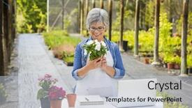  Presentation with working woman - Audience pleasing slide deck consisting of beautiful mature woman working in a greenhouse holding flowers on her hands backdrop and a light gray colored foreground