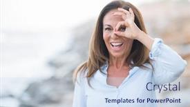  Presentation with sea shore - Audience pleasing theme consisting of beautiful middle age hispanic woman at the sea shore on a sunny day with happy face smiling doing ok sign with hand on eye looking through fingers backdrop and a sky blue colored foreground