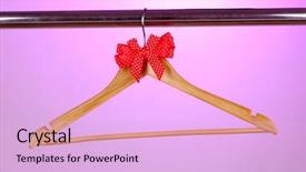  Presentation with red bow - Presentation theme having beautiful red bow hanging on wooden hanger on purple background background and a lavender colored foreground