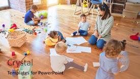  Presentation with toddlers - Amazing slide set having beautiful teacher and group of toddlers sitting on the floor drawing using paper and pencil around lots of toys at kindergarten backdrop and a coral colored foreground