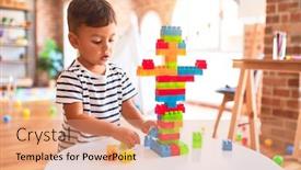  Presentation with vertical dome construction - Presentation theme consisting of beautiful toddler boy playing with construction blocks at kindergarten background and a coral colored foreground