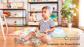  Presentation with toddler eating - Audience pleasing presentation theme consisting of beautiful toddler boy sitting on puzzle eating small colored chocolate balls at kindergarten backdrop and a coral colored foreground