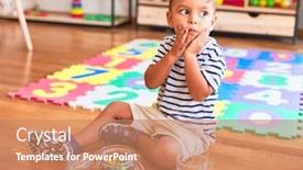  Presentation with toddler eating - PPT theme enhanced with beautiful toddler boy sitting on puzzle eating small colored chocolate balls at kindergarten background and a coral colored foreground