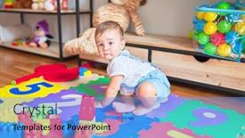  Presentation with building blocks - Amazing PPT theme having beautiful-toddler-sitting-on-puzzle backdrop and a light blue colored foreground