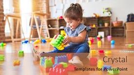  Presentation with building blocks - Amazing PPT layouts having beautiful-toddler-sitting backdrop and a coral colored foreground