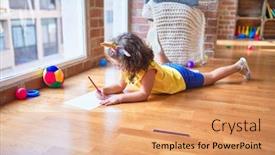  Presentation with unicorn - PPT theme featuring beautiful toddler wearing glasses and unicorn diadem lying down on the floor drawing using paper and pencil at kindergarten background and a coral colored foreground