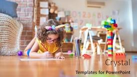 Presentation with unicorn - Audience pleasing presentation consisting of beautiful toddler wearing glasses and unicorn diadem lying down on the floor drawing using paper and pencil at kindergarten backdrop and a coral colored foreground