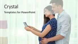  Presentation with ultrasound - Audience pleasing theme consisting of beautiful young pregnant couple looking at ultrasound image on light background backdrop and a cool aqua colored foreground